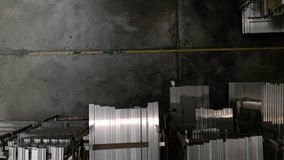 Industry business production and heavy metallurgical industrial products, many shiny aluminium profiles, industrial background, manufacturing business production concept in factory warehouse. - Powered by Shutterstock - Get 15% off with code: PIKWIZARD15