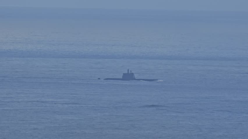 A submarine is floating in the ocean