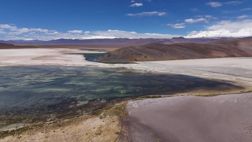 Majestic aerial shot of Laguna Santa Rosa in Atacama Desert Ojos del Salado volcano aerial view South America. Laguna Santa Rosa Atacama Desert Ojos del Salado volcano South America