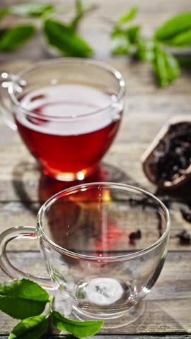 Pouring Hot Tea in Transparent Mug