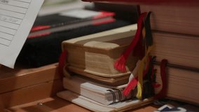 choir singing from catholic songbook during service in church - Powered by Shutterstock - Get 15% off with code: PIKWIZARD15