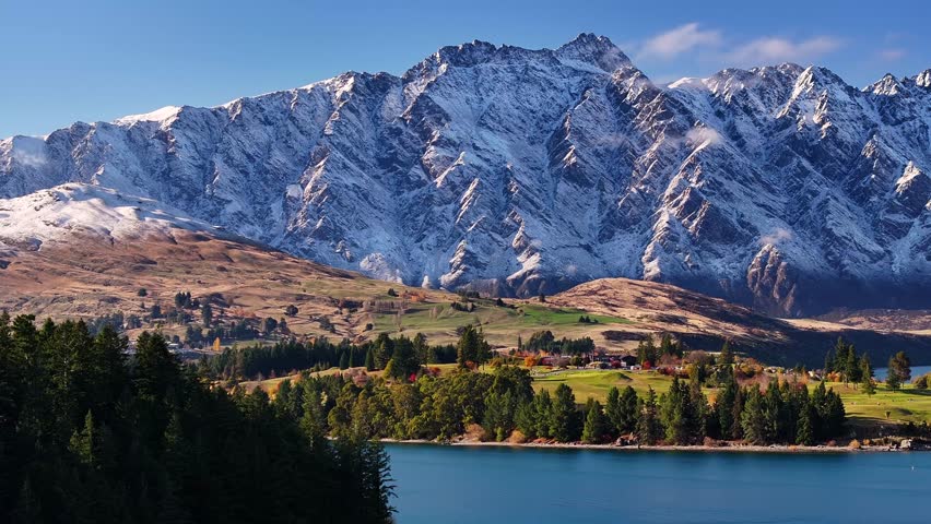 Fresh snow on The Remarkables mountain range in Queenstown. Beautiful natural landscape. New Zealand aerial