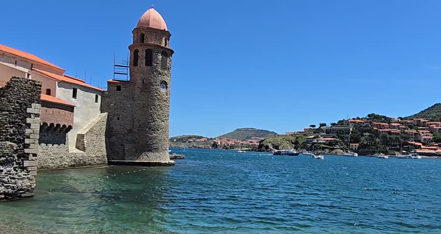 High definition video of the tower of the Eglise Notre dame des Anges and Collioure Beach, Plage de Collioure, a picturesque french town on the Mediterranean coast of Southern France