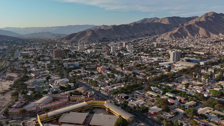 Aerial view of Copiapo in Chile with majestic mountains in distance urban life and natural beauty. Aerial view of Copiapo Chile towering mountains in background harmony between city and nature