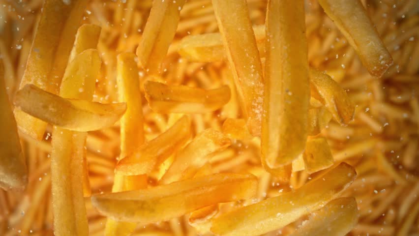 Super Slow Motion Shot of Falling French Fries and Salt Followed by Camera at 1000 fps.