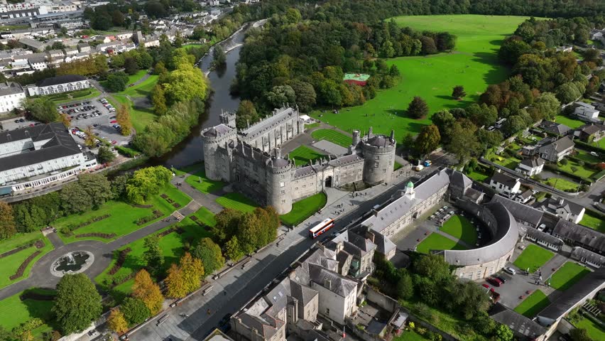 Kilkenny Castle, County Kilkenny, Ireland, September 2023. Drone orbits with views of the elegant formal gardens and Design Center and Workshops in the foreground.