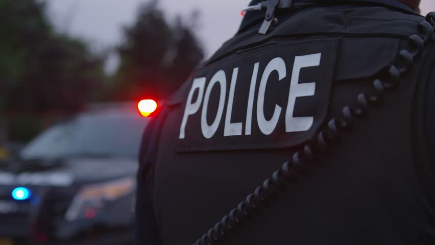 A policeman with his police mobile on standby
