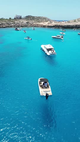 Cyprus blue lagoon boats, yachts aerial view with crystal clear water, turquoise clear