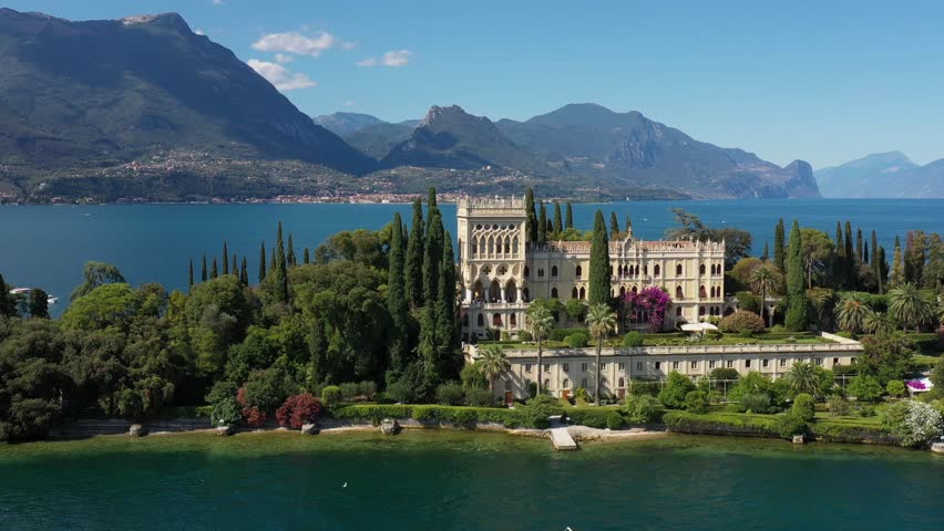 Aerial view of Isola del Garda, Lake Garda, Italy. Isola del Garda on Lake Garda features the historic Borghese Cavazza villa, lush botanical gardens, and stunning lake views.
