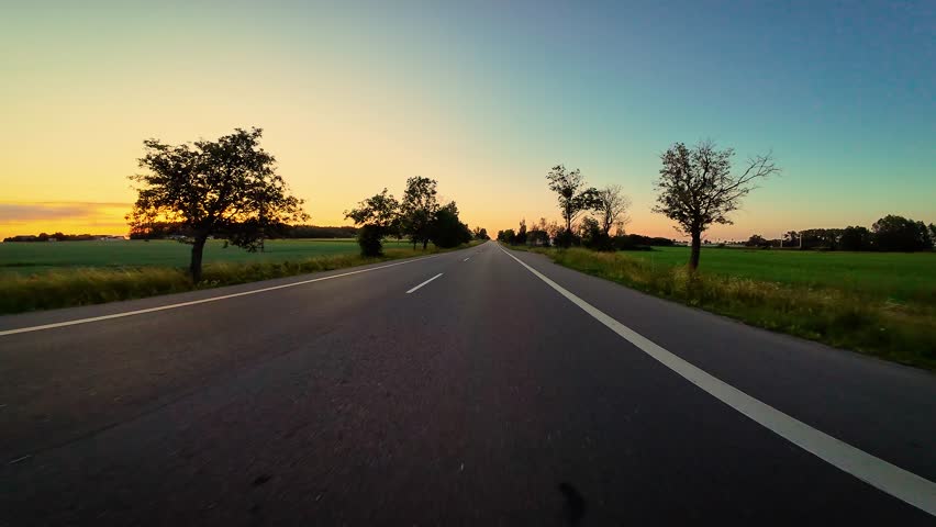 Car point of view driving by Poland road at sunset. Windshield and breathtaking POV views, Activity, travel, relaxation, adventures - Powered by Shutterstock - Get 15% off with code: PIKWIZARD15