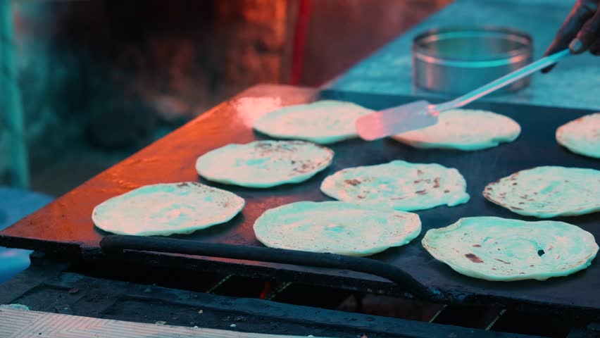 lachha paratha, closeup shot of Indian cuisine Garlic Paratha, multi layered fried flatbread selective focus video, layered flat bread over white cloth.