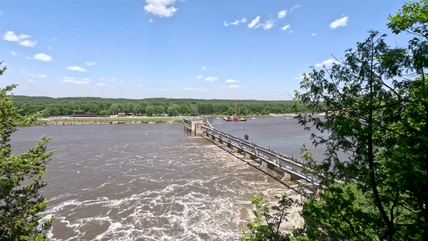 Peeking through the trees with views of a large dam on the Illinois River. Located within Starved Rock State Park in LaSalle County, Illinois.