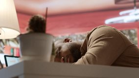 Entrepreneur sleeping on his home office desk after stressful analysis for the online business he is running. Tired fatigued businessman getting some rest with a nap, burnout. Camera A. - Powered by Shutterstock - Get 15% off with code: PIKWIZARD15