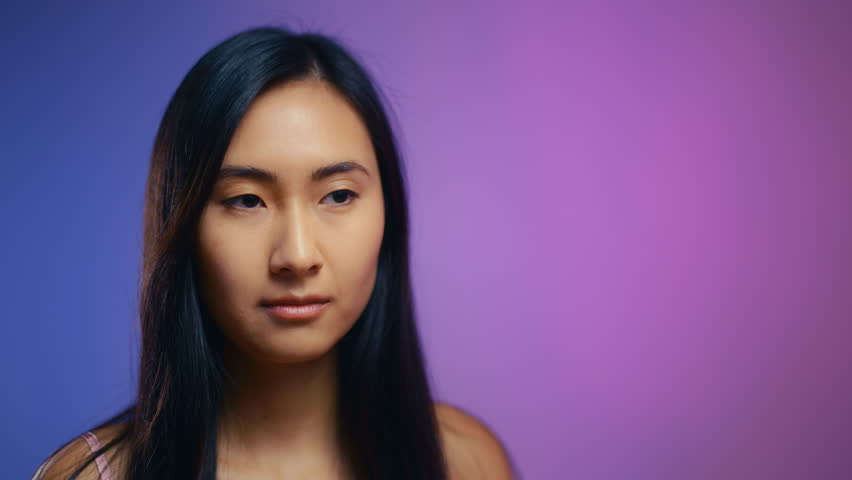 Happy Asian woman combing her healthy shiny hair, beauty routine, hair vitamins