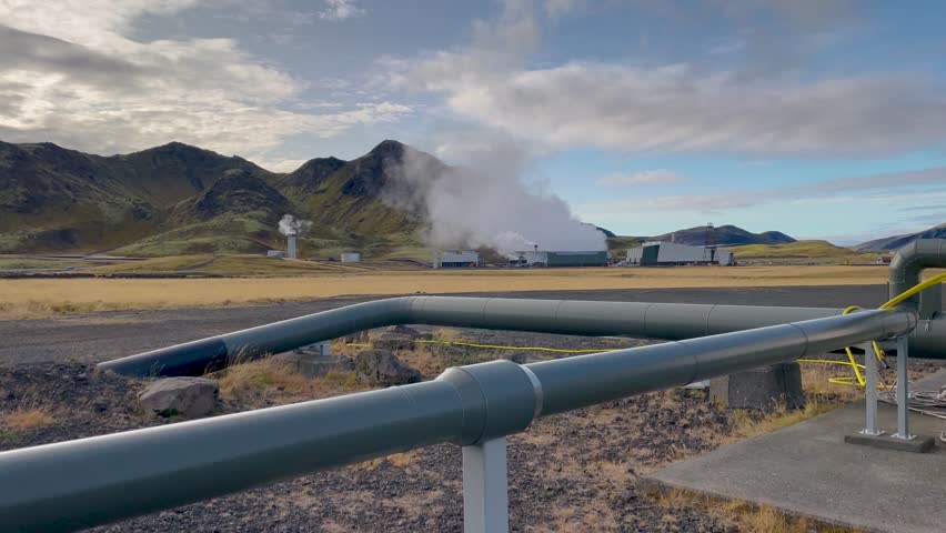 Industrial site near Reykjavik, Iceland, showing geothermal plant with steam rising