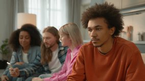 African American sad pensive thinking troubled problem frustrated man guy male at home separated ignore multiracial Caucasian multiethnic friends women men mobile phone using addicted laughing talking - Powered by Shutterstock - Get 15% off with code: PIKWIZARD15