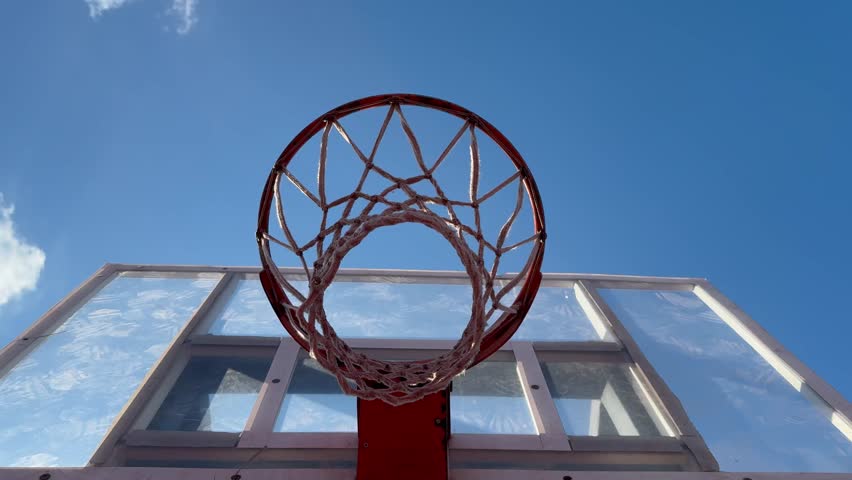  slow motion of basketball ball hitting the basket. Filmed on high speed cinema camera, Camera in motion. Speed ramp effect.
