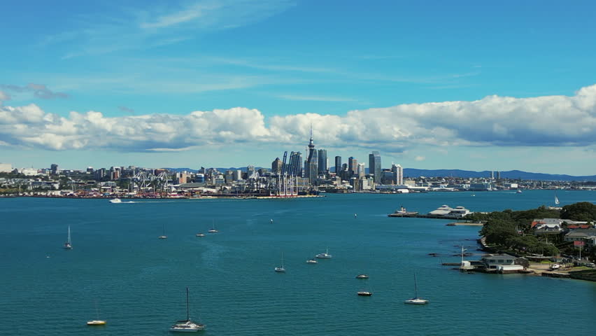 Auckland New Zealand city skyline daytime - pullback aerial reveal