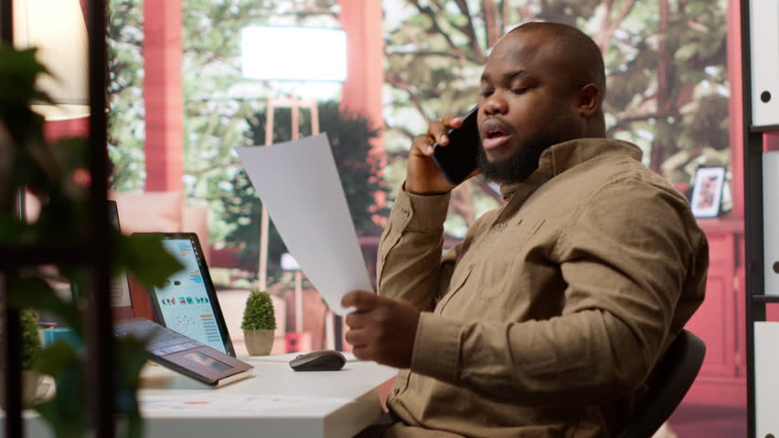 Business administrator discussing with the investors on phone call, communicating the sales numbers and performance metrics during analysis. Entrepreneur hoping to obtain new funds. Camera A. - Powered by Shutterstock - Get 15% off with code: PIKWIZARD15