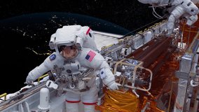 Astronauts repairing a satellite - spacewalk - Powered by Shutterstock - Get 15% off with code: PIKWIZARD15