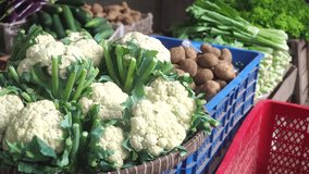 Cauliflower in bamboo basket at traditional market stall. Focus selected - Powered by Shutterstock - Get 15% off with code: PIKWIZARD15