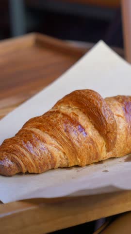 top view of hand pick fresh baked croissant 