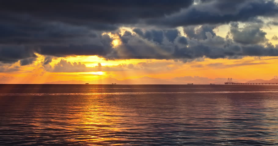 Beautiful coastline and spectacular sky clouds natural landscape at sunrise in Zhuhai, Guangdong Province, China. Famous holiday resort.