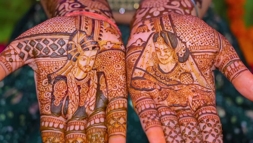 indian hindu bride showing her beautful mehandi artwork