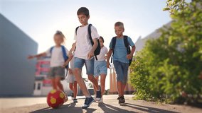 children near the school playing soccer. kids a school education kid dream concept. a group of children near the school lifestyle playing ball. a group of school children playing - Powered by Shutterstock - Get 15% off with code: PIKWIZARD15