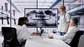 Dentist Doctor Looking At Teeth Xray Using Computer Software - Powered by Shutterstock - Get 15% off with code: PIKWIZARD15