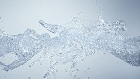 Super Slow Motion Shot of Pure Water Splashes Flying Towards on Light Blue Background at 1000fps. - Powered by Shutterstock - Get 15% off with code: PIKWIZARD15