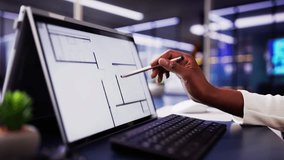 African-American Architect Using Digital Tablet to Analyze House Floor Plan for Real Estate Renovation Business. - Powered by Shutterstock - Get 15% off with code: PIKWIZARD15