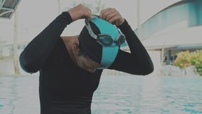 Young Asian Woman Swimmer Adjusting Her Swim Goggle Before Swimming - Powered by Shutterstock - Get 15% off with code: PIKWIZARD15