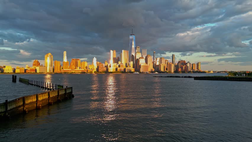 Cloud in NYC. New York City Skyline with dramatic sky. NYC near dramatic clouds. New York City skyline at dusk, cityscape of Manhattan in New York. Panoramic view on Manhattan. USA.