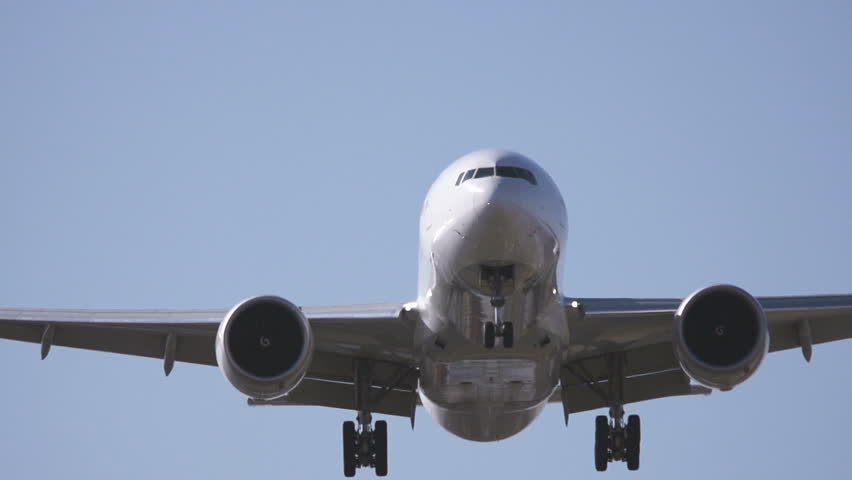 Airplane with two engines landing - close up
