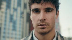 Close up portrait outdoors Caucasian adult 30s man millennial guy serious face looking upset sad worried unhappy gaze male tourist travel outside real estate agent businessman client in city downtown - Powered by Shutterstock - Get 15% off with code: PIKWIZARD15