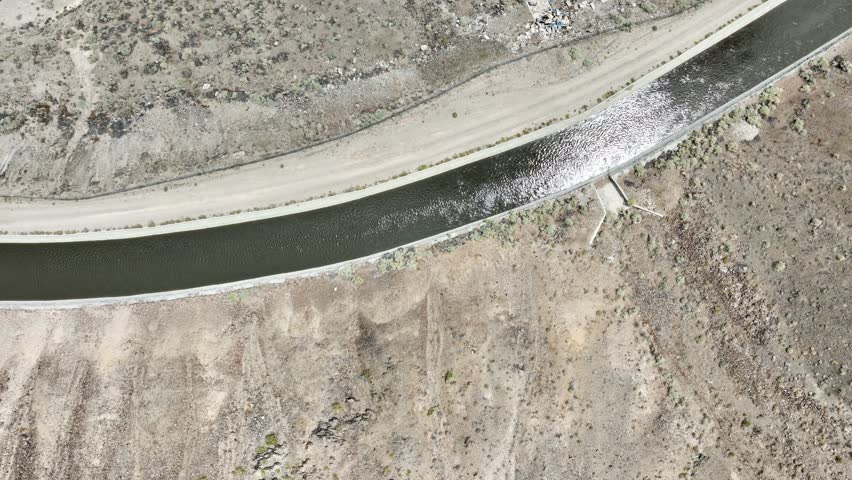 Aerial shot of the Los Angeles Aqueduct running through Owen’s Valley at the base of the Sierra Nevada Mountains in California. The aqueduct supplies water to Los Angeles and Southern California.