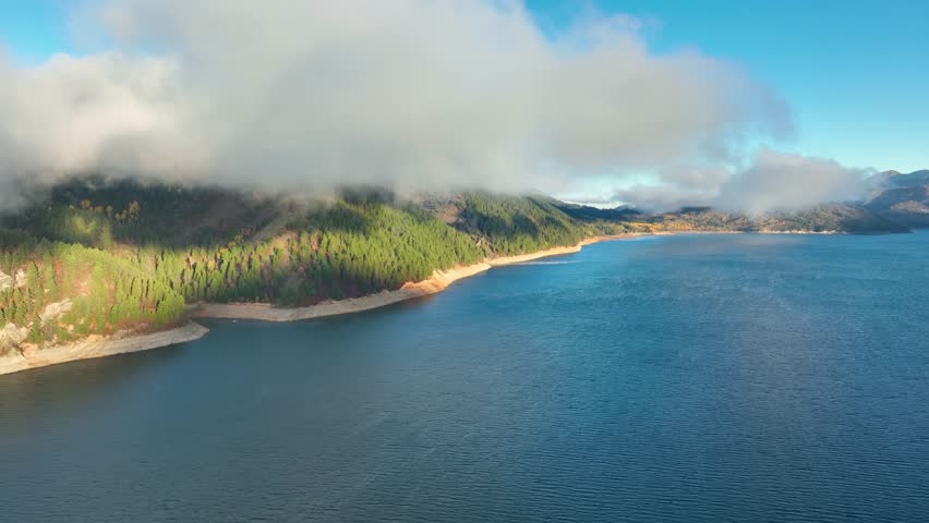 Aerial of low clouds above the Palisades Reservoir on the Snake River in Idaho.