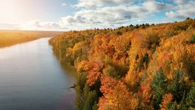 Aerial of maple trees turning their beautiful fall colors along a river in Michigan. - Powered by Shutterstock - Get 15% off with code: PIKWIZARD15