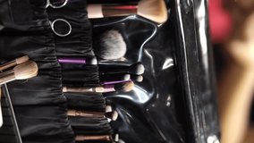 makeup artist workplace, makeup brushes on the table. Makeup fluffy brushes to work with client at table in contemporary beauty salon close up. Different tools and decorative cosmetics - Powered by Shutterstock - Get 15% off with code: PIKWIZARD15