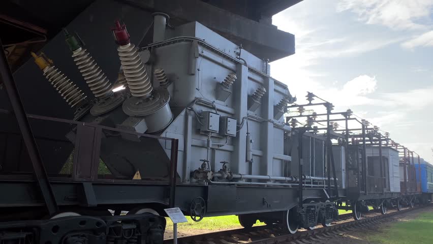 There is a large electricity generator on the train platform