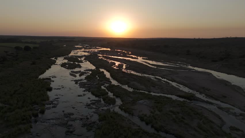 Breathtaking Drone flight over a large seasonal River during sunset, Crocodile River, Kruger National Park.