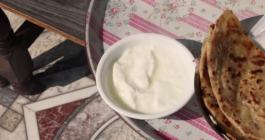 Popular Indian food Aloo Paratha with yogurt and pickles aloo paratha with curd