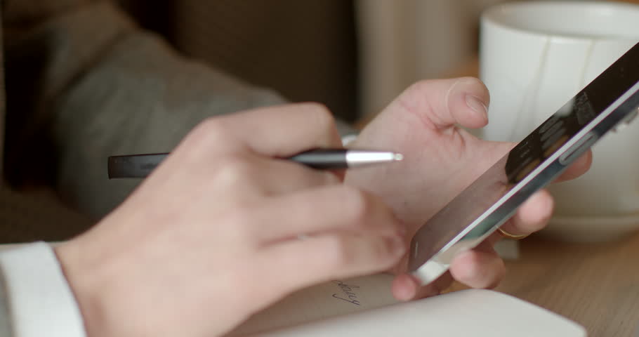 Smartphones are multifunctional devices as integral part of daily life for millions worldwide. Business people use social media platform using. Close-up woman uses mobile phone or smartphone in hands