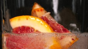 Pouring fizzy soda into glass swirling around grapefruit slices. Creating citrusy symphony of bubbles and aromas in refreshing lemonade - Powered by Shutterstock - Get 15% off with code: PIKWIZARD15