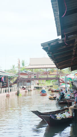 Local food and drink sell on wooden fishery boat floating market sightseeing travel in Thailand