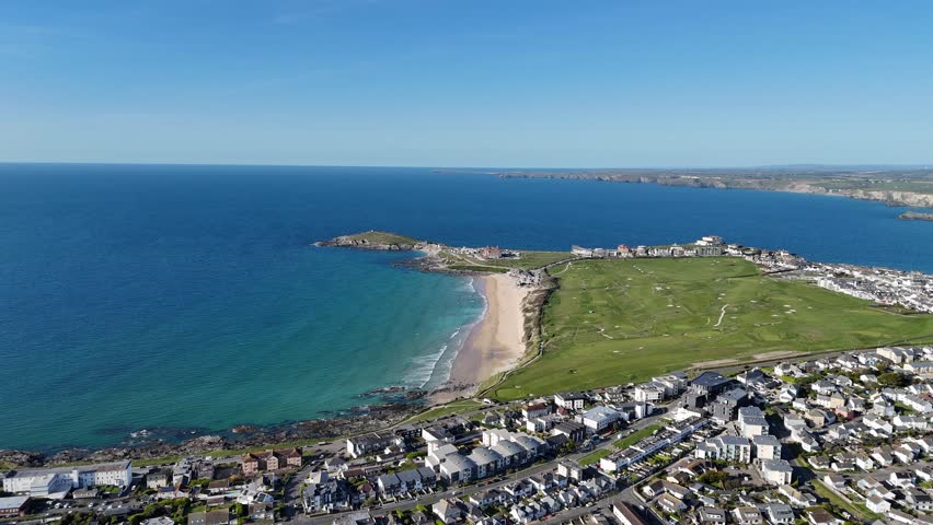Fistral Beach on the north coast of Cornwall, England, UK, next to Newquay. Summers day with blue sky and turquoise water filmed with a 4K drone.