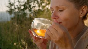 A woman drink green tea. - Powered by Shutterstock - Get 15% off with code: PIKWIZARD15