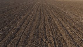 Plowed farmland soil from drone pov, aerial shot, high angle view - Powered by Shutterstock - Get 15% off with code: PIKWIZARD15