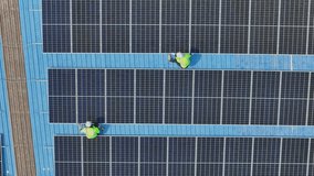 engineer man inspects construction of solar cell panel or photovoltaic cell by electronic device. Industrial Renewable energy of green power. factory worker working on tower roof. - Powered by Shutterstock - Get 15% off with code: PIKWIZARD15